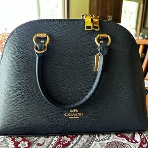 Coach navy blue satchel.